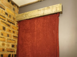 Window obscured by fabric and a box pelmet